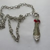 Spoon with red beads 1